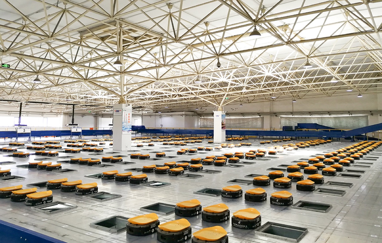 T-Sort robotic sorting deck with dense mobile robots and destination chutes